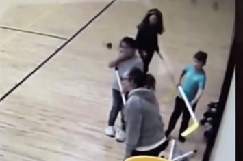 teacher throws hockey stick at child video