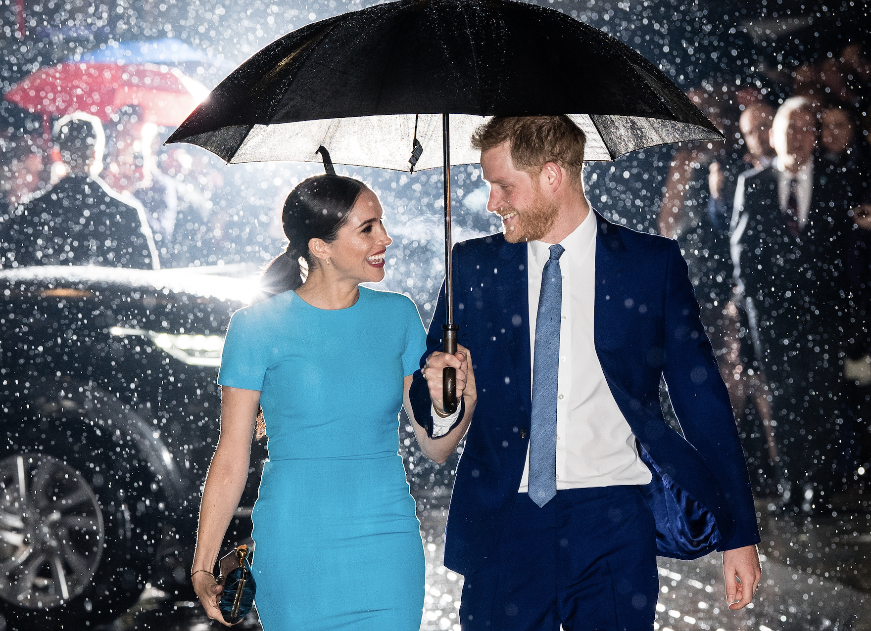 Meghan and Harry under an umbrella
