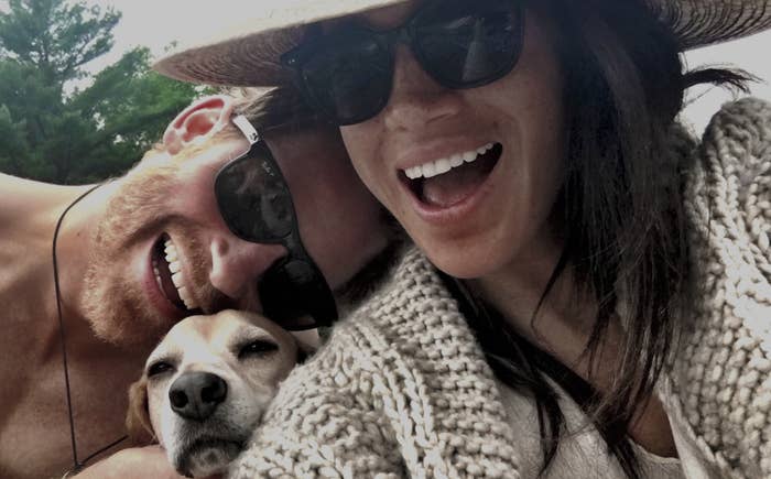 Closeup of Prince Harry and Meghan Markle with their dog