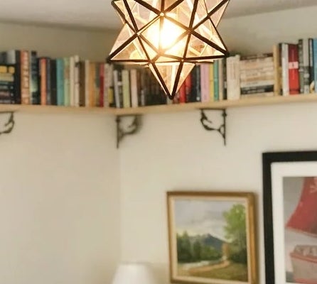 The pendant star light hanging in a bedroom