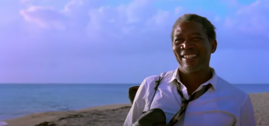 A man smiles on the beach