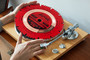 A vinyl blade record is pictured being placed on a record player