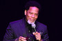 Comedian DL Hughley is pictured performing standup