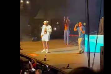 Kevin Gates is seen performing with a memed man