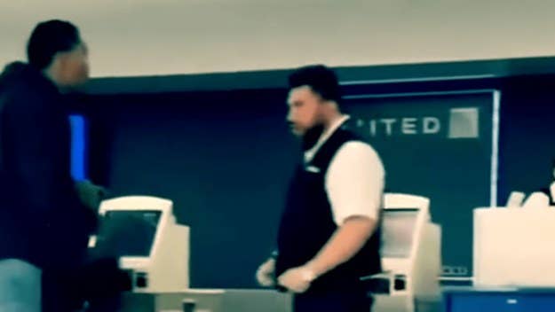 A new video has surfaced showing a one-on-one fight at Newark Airport between an ex-NFL player and a United Airlines employee, who has since been fired.