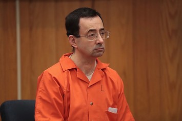 Larry Nassar sits in court listening to statements before being sentenced by Judge Janice Cunningham