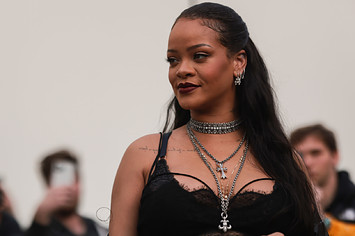 Rihanna is pictured at an event with photographers