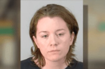 Mugshot of Florida babysitter who is accused of putting 4-year-old in dryer