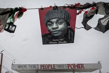 Amir Locke's picture is seen during a heavy snowstorm at George Floyd Square in Minneapolis, Minnesota,