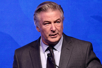 Alec Baldwin is pictured speaking at a podium