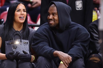 Rapper Kanye West and girlfriend Chaney Jones attend a game between the Miami Heat and the Minnesota Timberwolves