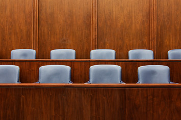 This photo shows jury chairs in a court room
