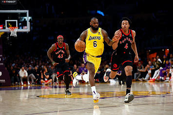 LeBron James #6 of the Los Angeles Lakers and Scottie Barnes #4 of the Toronto Raptors at Crypto.com Arena