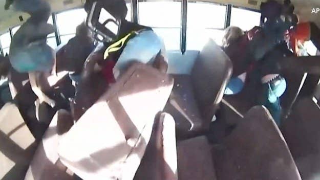 Video footage shows a man racing his white Mustang and crashing into a school bus full of children, flipping the bus and leaving two students injured.