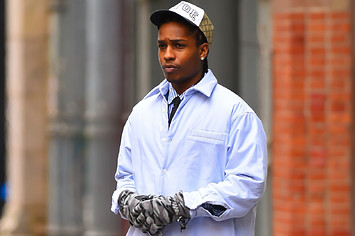 ASAP Rocky is pictured outside wearing gloves and a hat