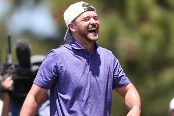 Musician Justin Timberlake smiles on the 17th hole during round two of the American Century Championship at Edgewood Tahoe South golf course