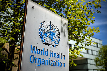 A picture taken on May 8, 2021 shows a sign of the World Health Organization (WHO) at the entrance of their headquarters