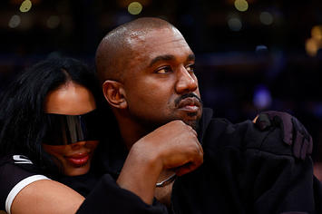 Rapper Kanye West and girlfriend Chaney Jones attend a game between the Washington Wizards and the Los Angeles Lakers