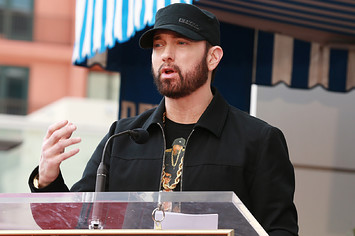 Eminem is seen at a microphone