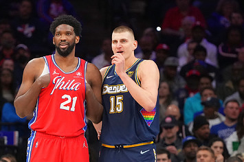 Joel Embiid #21 of the Philadelphia 76ers talks to Nikola Jokic #15 of the Denver Nuggets