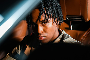 Ottawa rapper TwoTiime sitting in a car.