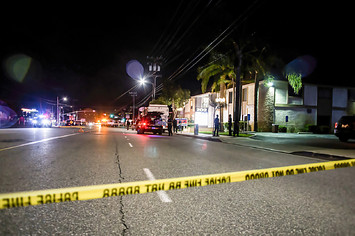 Photograph of police tape at crime scene