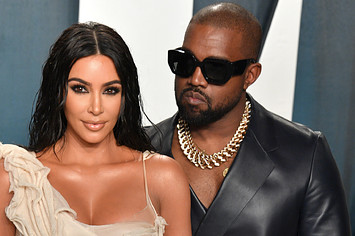 Kim and Kanye on a red carpet in better days