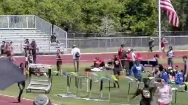 Footage of a high school track meet went viral after one of the athletes ran up and sucker-punched another in the back of the head, sending him to the ground.