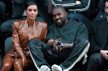 Kim Kardashian and Kanye West attend the Balenciaga show.