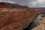 The Colorado River flows by the historic Navajo Bridge.