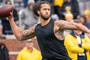 Colin Kaepernick participates in a throwing exhibition during half time of the Michigan spring football game