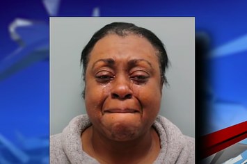 A woman is pictured after being charged in an alleged murder