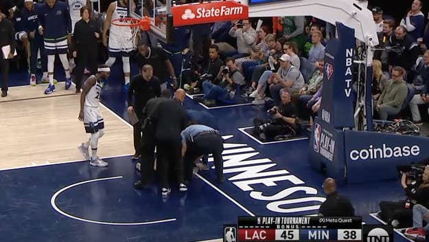 A woman tried to glue herself to the court during Thursday night's play-in game between the Minnesota Timberwolves and Los Angeles Clippers at Target Center.