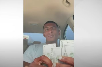 Video of hitman counting cash allegedly received for killing a TSA agent.