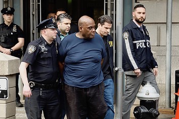 Suspected subway shooter, Frank James is escorted out by the FBI and NYPD officers