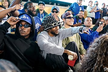 Kendrick Lamar is seen at a baseball game