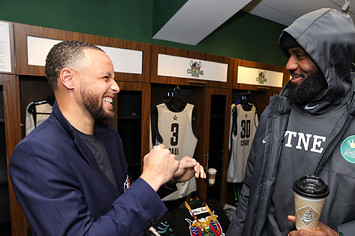 Stephen Curry #30 of Team LeBron talks to LeBron James.