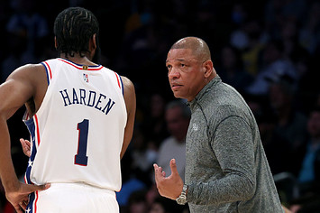 Head coach Doc Rivers of the Philadelphia 76ers speaks with James Harden