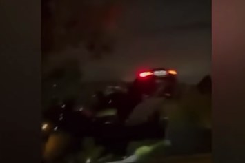 A stunt driver is seen crashing a Tesla car