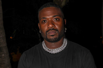 Ray J poses for photo outside an event.