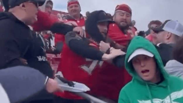 In several videos shot during the playoff game, recorded around when Philadelphia was down 31-0, two Eagles fans can be seen seemingly initiating a fight.