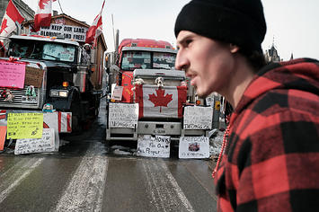 Hundreds of truck drivers and their supporters block the streets of downtown Ottawa as part of a convoy of protesters