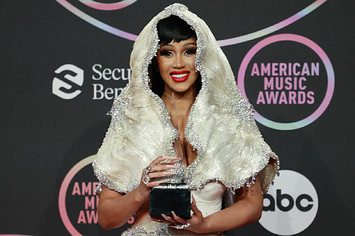 Cardi B poses with trophy at American Music Awards.
