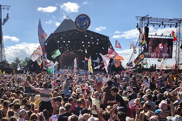 Crowds listen to Kylie perform on the Pyramid Stage at the 2019 Glastonbury Festival