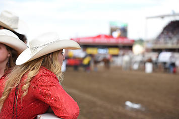 Cowgirls get ready to take in the GMC Rangeland Derby Chuckwagon Races at the Calgary Stampede