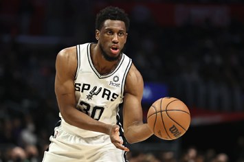 haddeus Young #30 of the San Antonio Spurs passes the ball