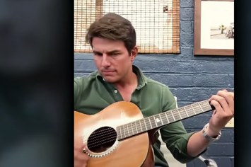 A Tom deepfake is pictured playing guitar