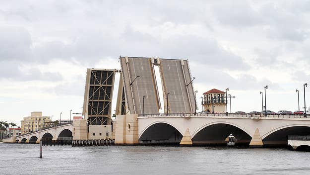 A woman in West Palm Beach, Florida fell to her death suddenly on Sunday, after a drawbridge was raised as she walked across it with her bike.