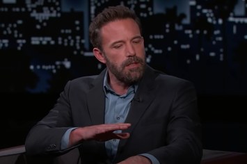 Ben Affleck is pictured wearing a blazer and speaking