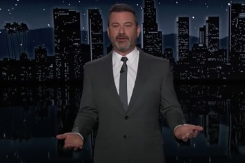 Jimmy Kimmel is pictured wearing a suit and talking
